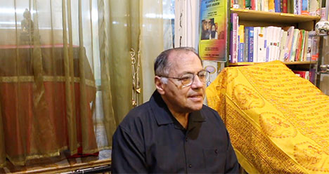 Cyrus Ryan giving a talk in a London bookshop