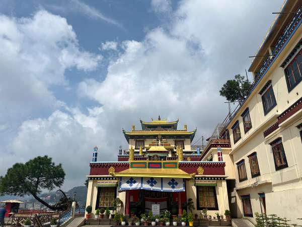 a yellow and red building with a yellow roof