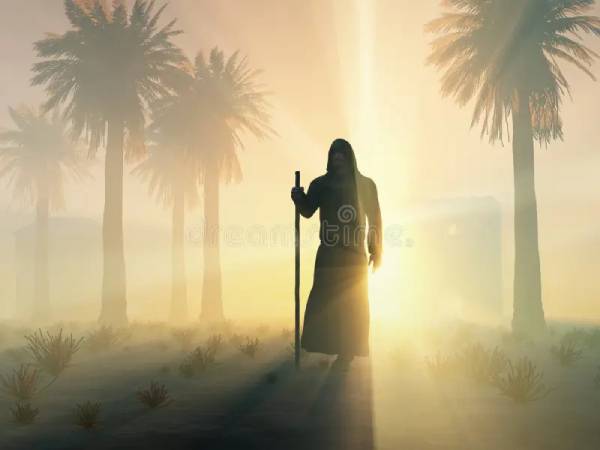 a silhouette of a robed figure with a staff